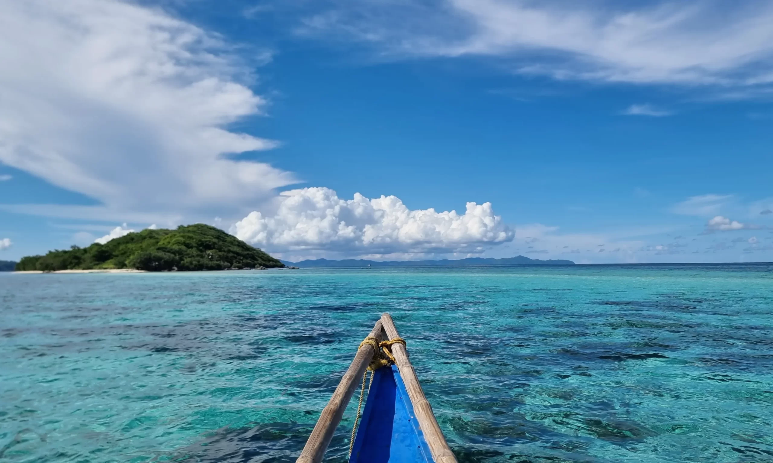 traditional boat sailing in el nido, crystal water, tropical island.